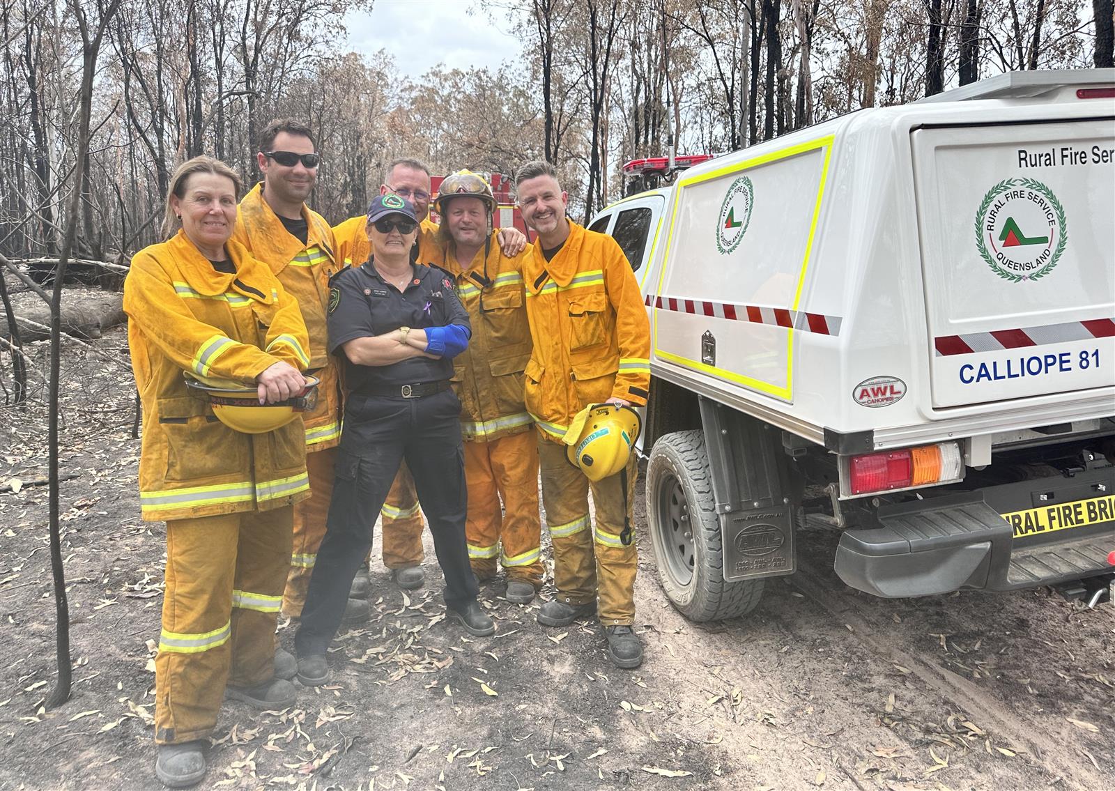 Tracy Kierys with CFA firefighters Anne Greelish, Nick Webb, Rod Marks, Brad Newman and Elvis Crook in Queensland, 2023